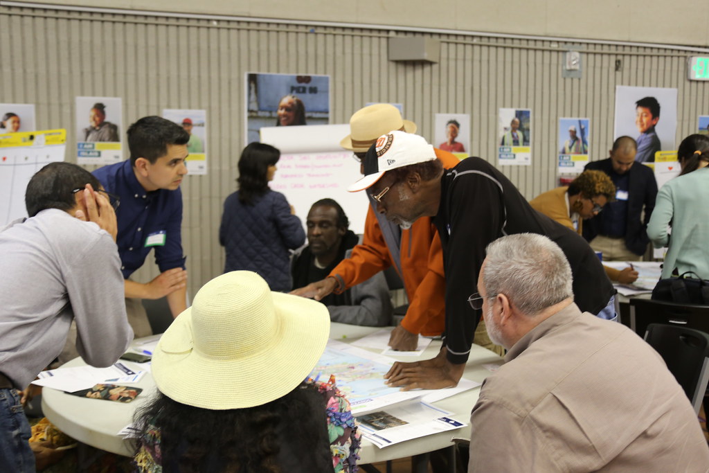 Group of people gather at a community workshop