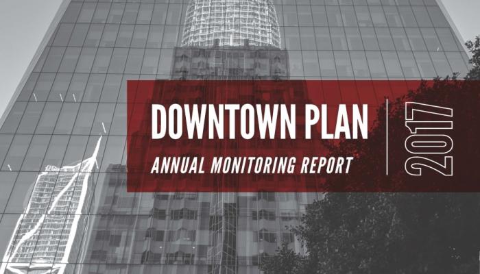 A cover for the 2017 Downtown Plan Annual Monitoring Report featuring a red and black title block overlaid on a background of modern glass skyscrapers including the Salesforce Tower.