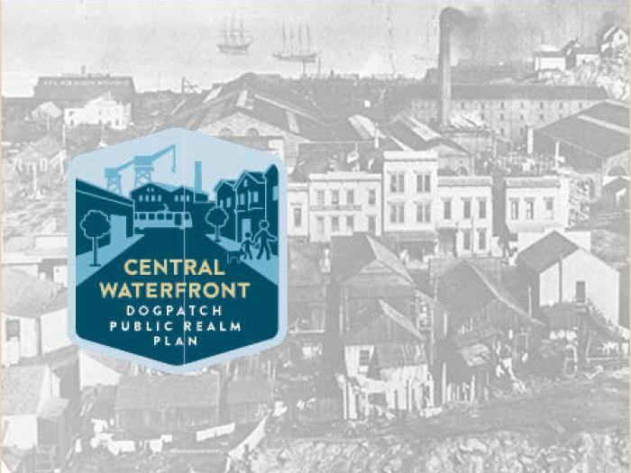 A black and white historical photograph of an industrial waterfront area featuring a large factory with several smoking chimneys and a cluster of classic San Francisco houses, with a blue graphic overlay in the bottom left corner that reads Central Waterfront Dogpatch Public Realm Plan.