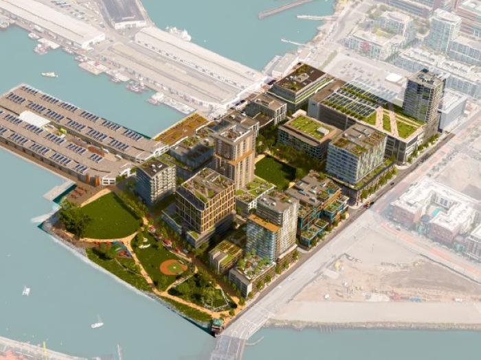 Aerial architectural rendering of the Mission Rock master plan along the San Francisco waterfront, showing new residential buildings, green spaces, and a public plaza next to the water.