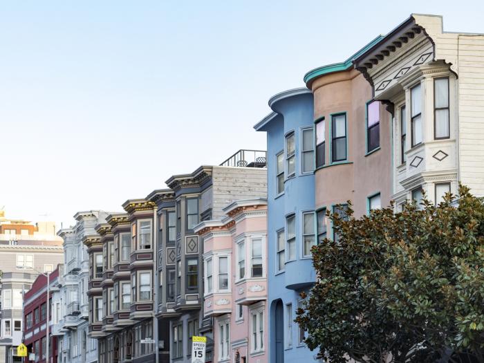 Row of historic pastel colored buildings with classic bay windows on Filbert Street