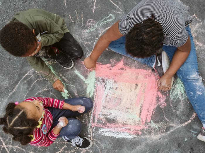 Children drawing with chalk
