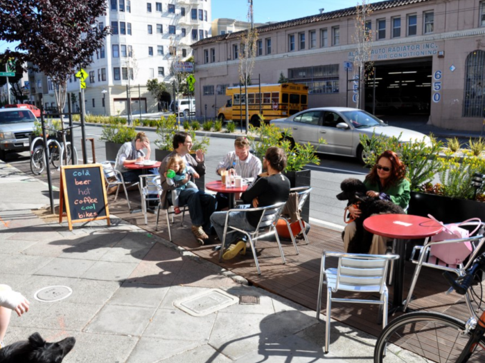 people sitting at tables outside a café on Divisadero