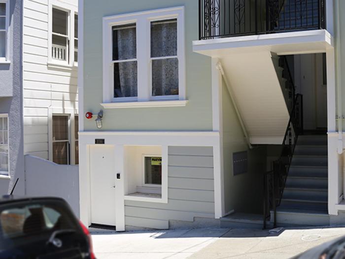 street view of apartment building showing additional unit added to basement level