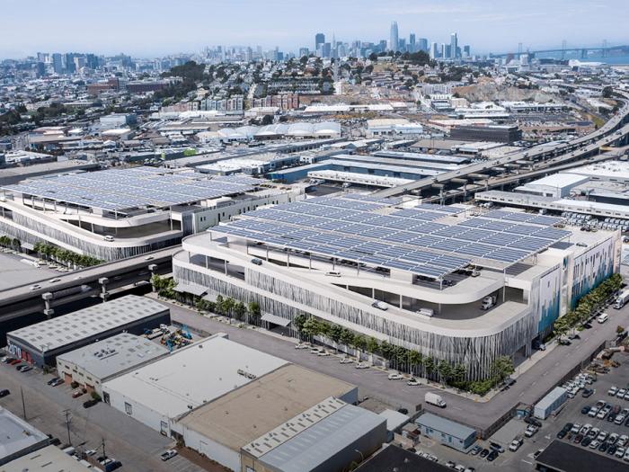 rendering of aerial view of proposed buildings with downtown SF in background